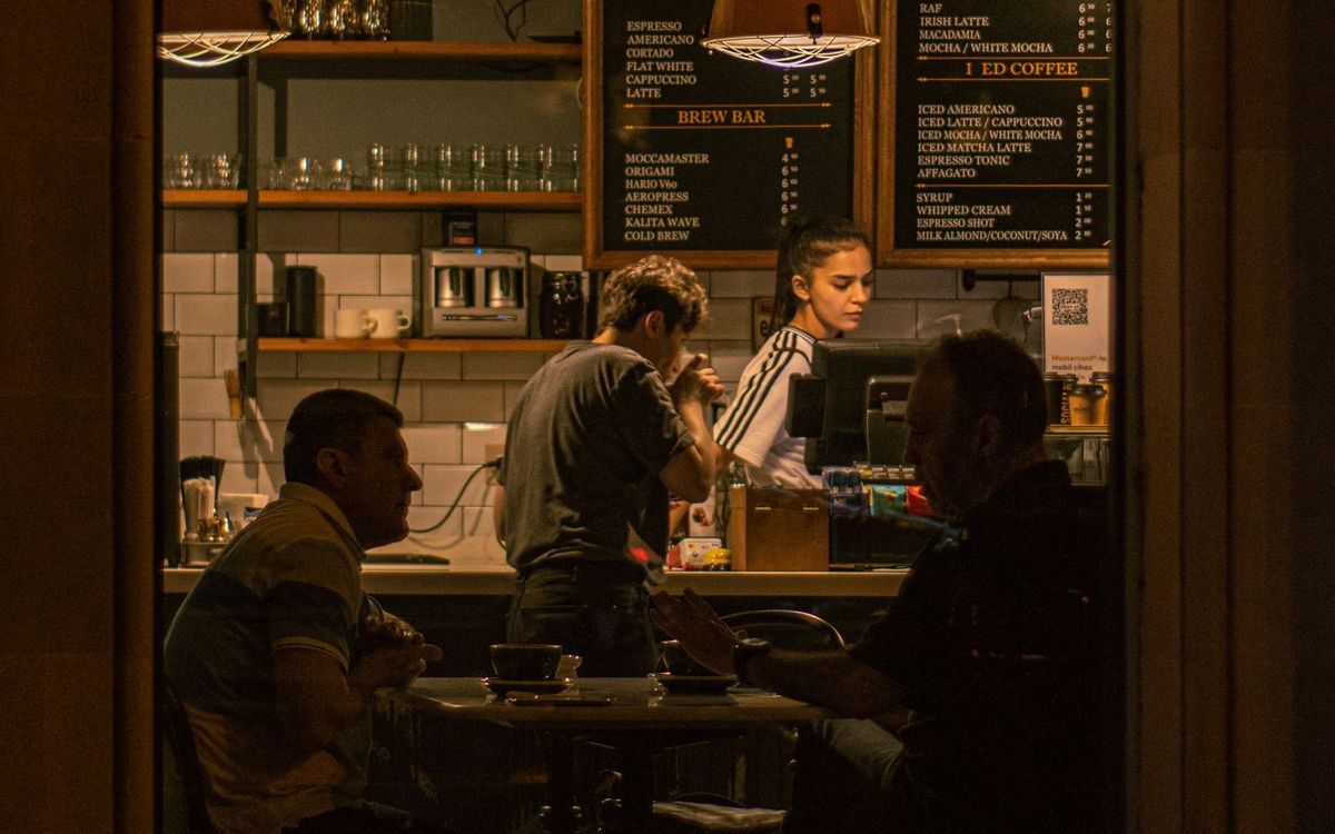 Guests at a cafe counter on a weeknight
