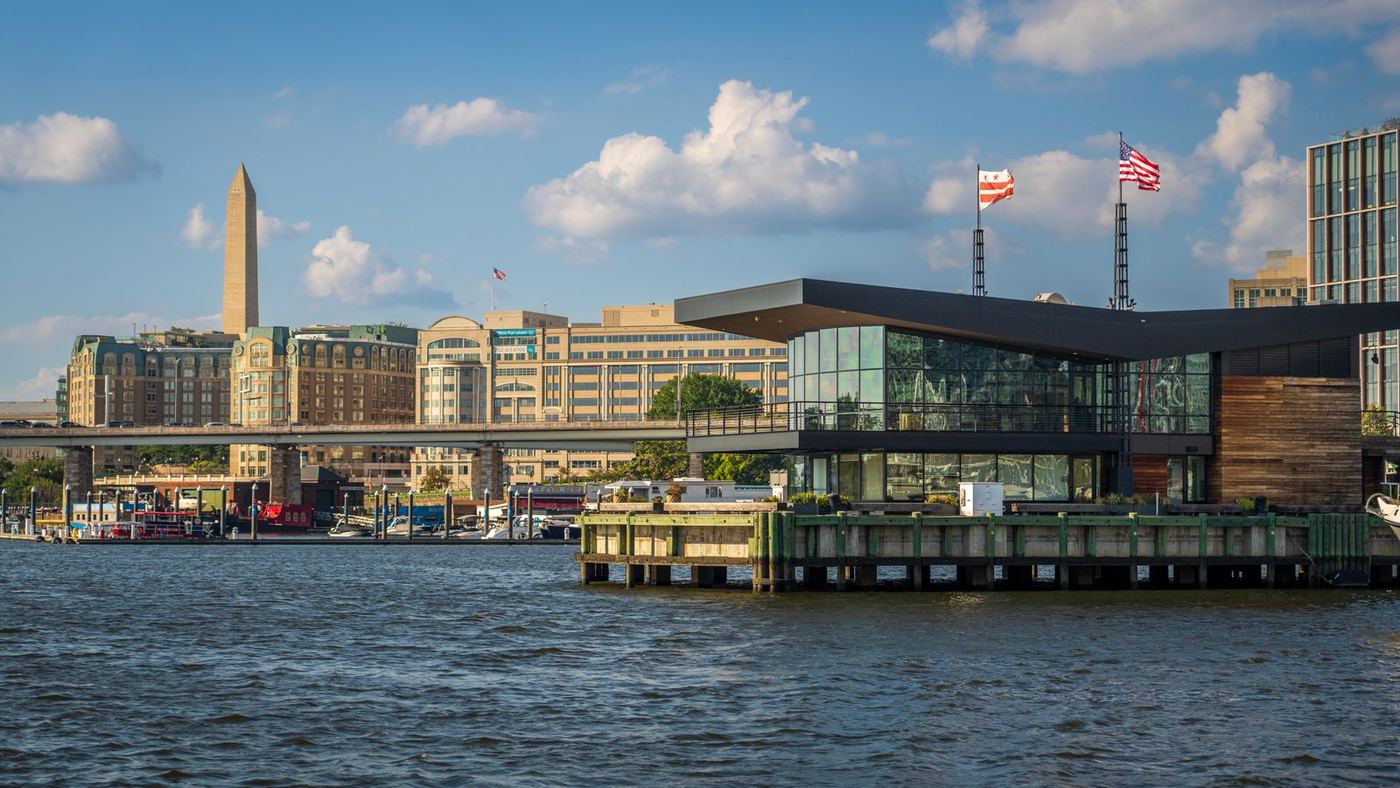 The Wharf waterfront in Washington DC with the Washington Monument in the distance