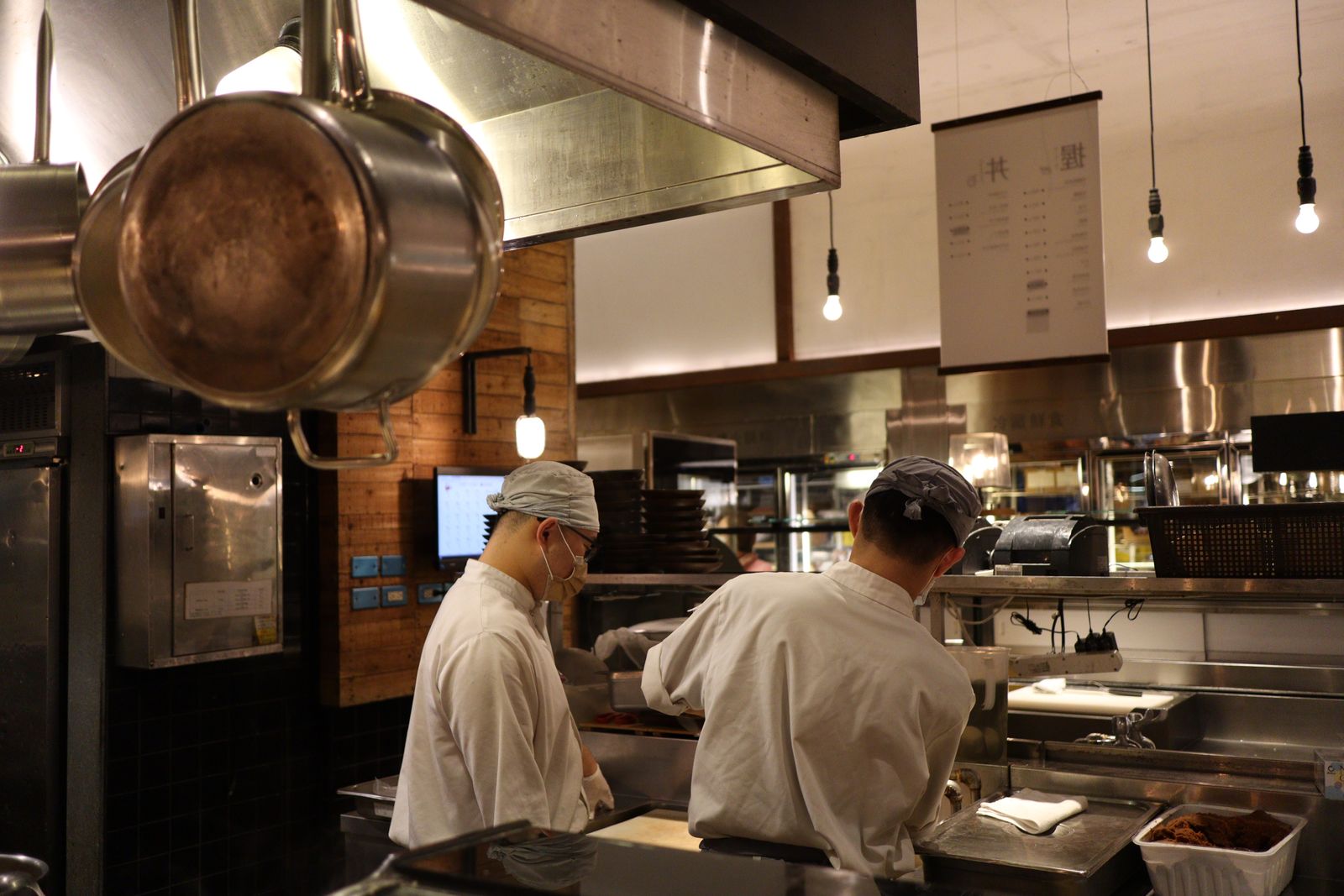 Chefs working the line in a busy restaurant kitchen