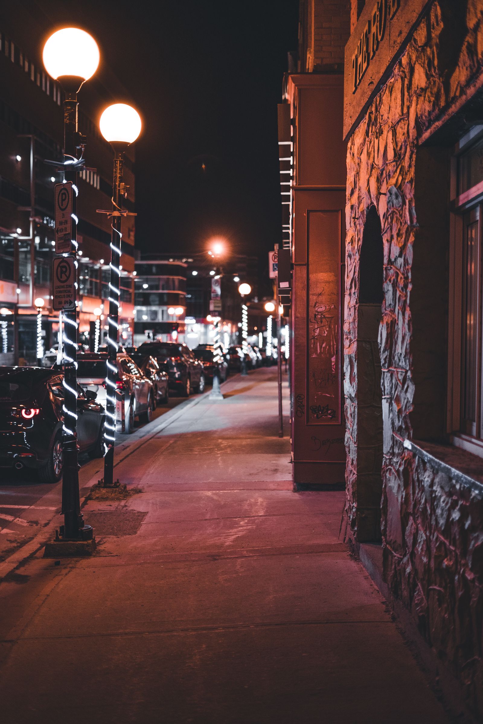 A Hampton Roads street at night under warm street lights